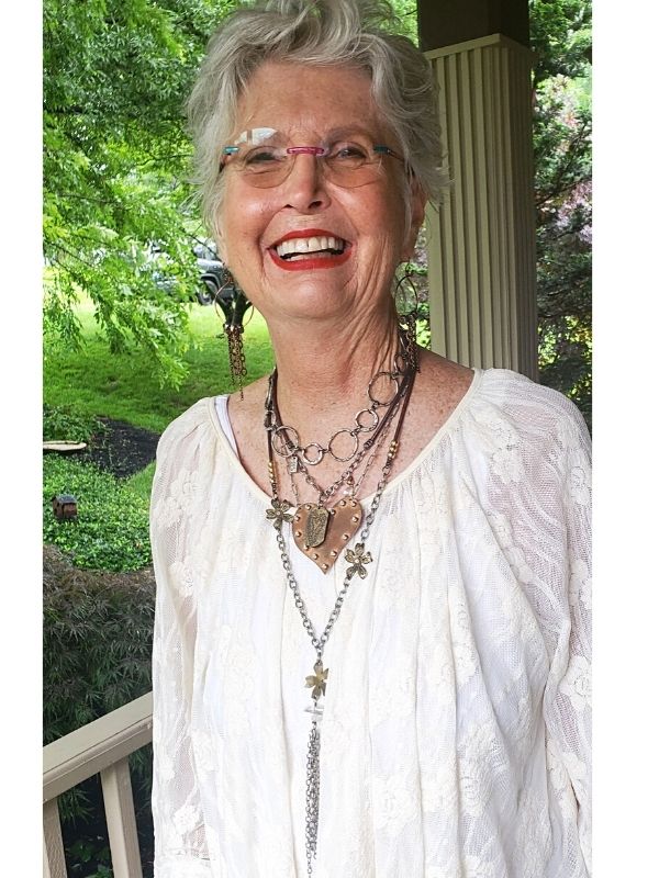 wearing many layers of mixed metal jewelry